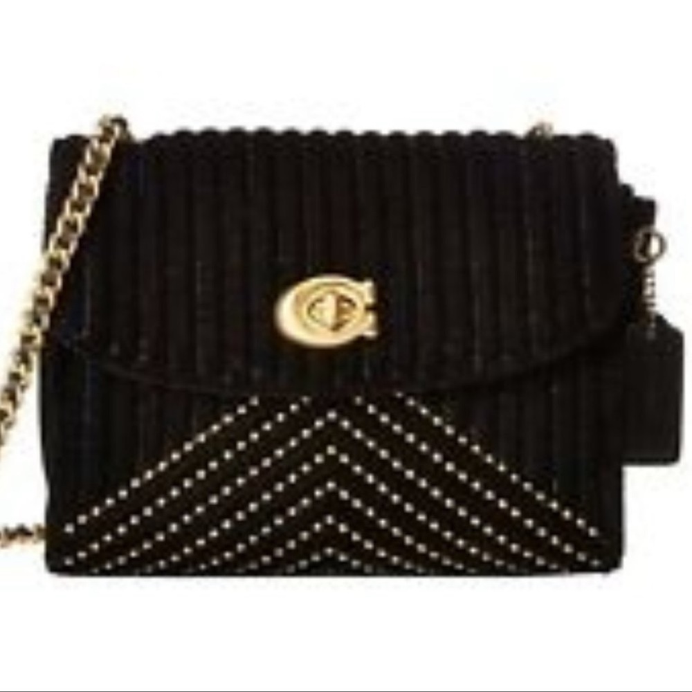 Coach Parker black velvet shoulder bag with gold accents.